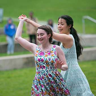 Two students running in the park